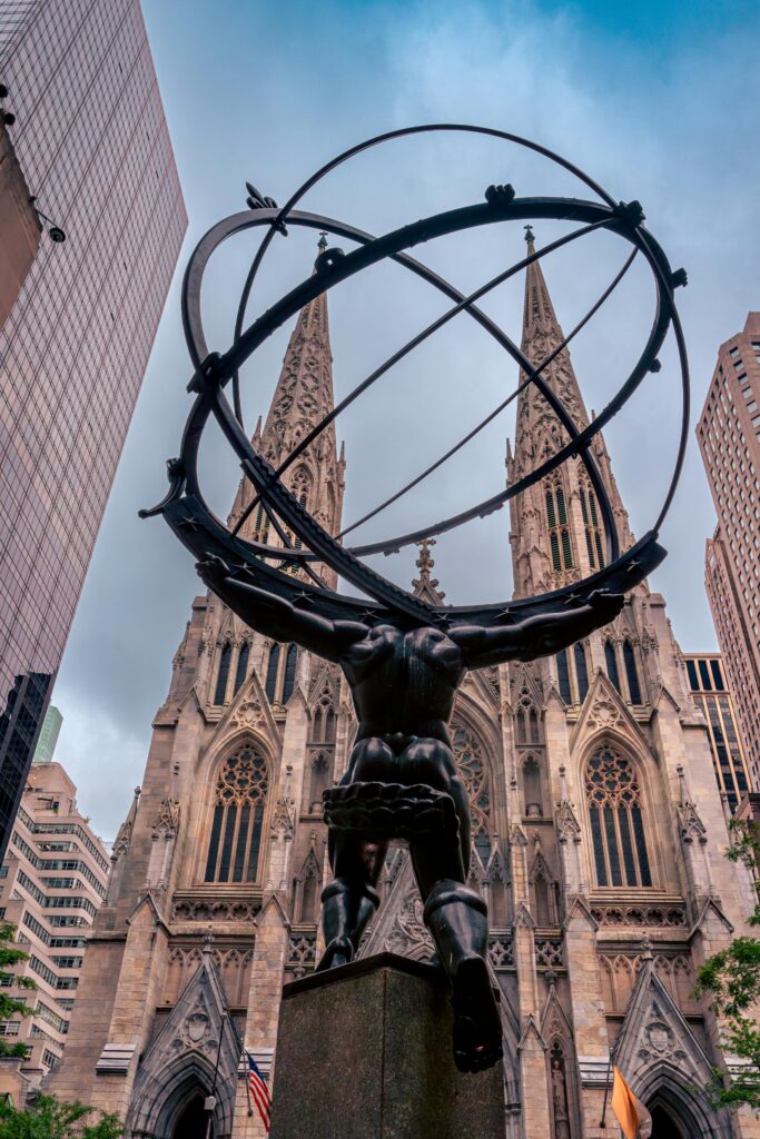 View of Atlas statue with St. Patrick's Cathedral in the background, New York City.